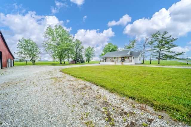 4491 W 600 N, Anderson, IN 46011 - view of front of property with curved driveway, a front yard, and covered porch
