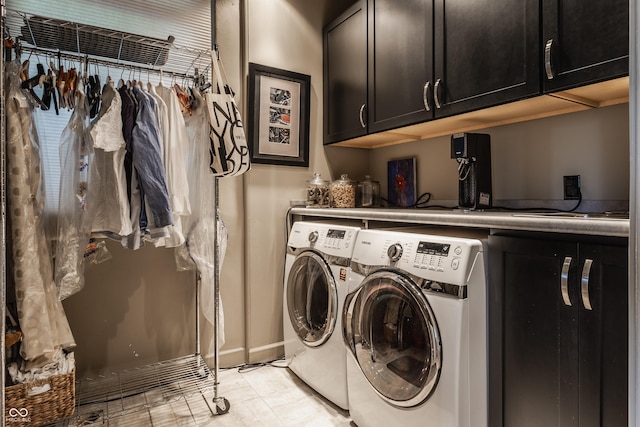 3959 Central Ave, Indianapolis, IN 46205 - washroom featuring cabinet space and washer and dryer