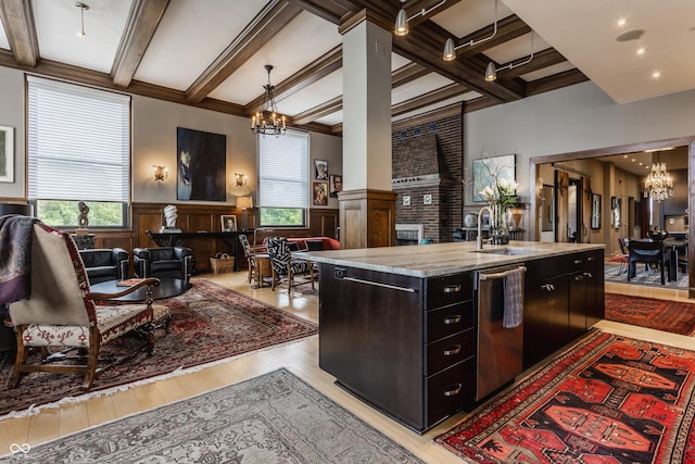 3959 Central Ave, Indianapolis, IN 46205 - kitchen with a chandelier, beam ceiling, light wood finished floors, open floor plan, and wainscoting