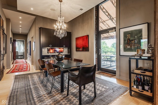 3959 Central Ave, Indianapolis, IN 46205 - dining space with recessed lighting, a chandelier, and light wood finished floors