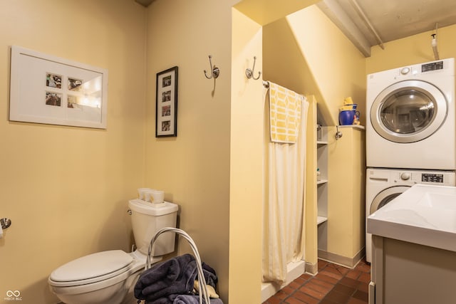 3959 Central Ave, Indianapolis, IN 46205 - bathroom with stacked washing machine and dryer, a stall shower, vanity, and tile patterned flooring