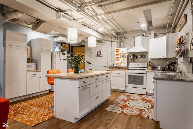 3959 Central Ave, Indianapolis, IN 46205 - kitchen featuring white appliances, custom range hood, dark wood-style flooring, and white cabinetry