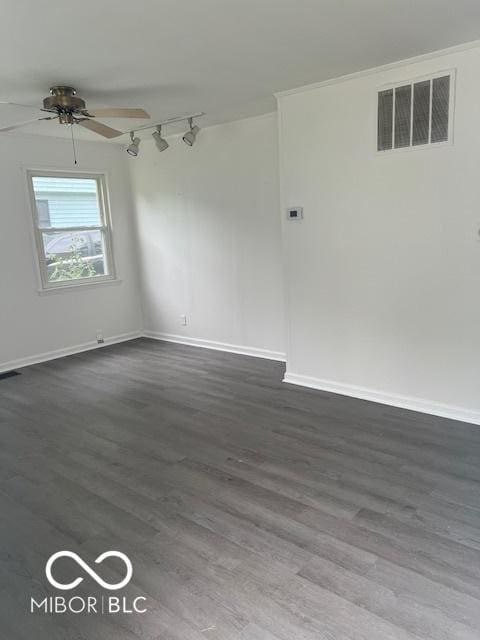 5312 N Kercheval Dr, Indianapolis, IN 46226 - unfurnished room featuring dark wood-style flooring, a ceiling fan, and rail lighting