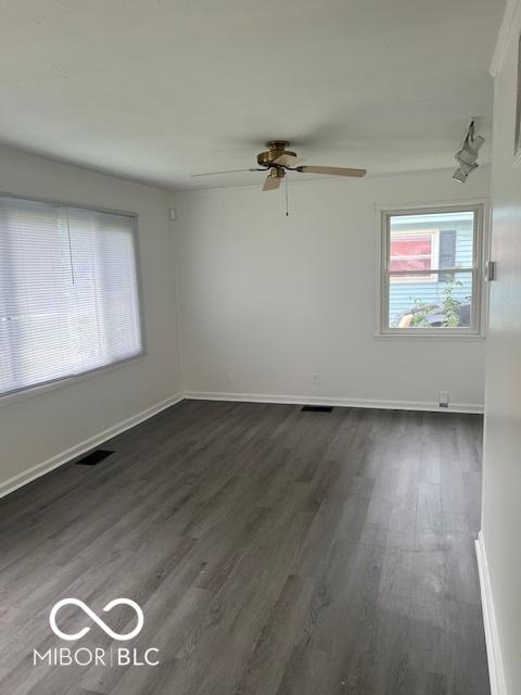 5312 N Kercheval Dr, Indianapolis, IN 46226 - empty room with dark wood-style flooring and a ceiling fan