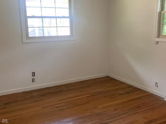 24 David Dr, North Vernon, IN 47265 - empty room featuring wood finished floors and healthy amount of natural light