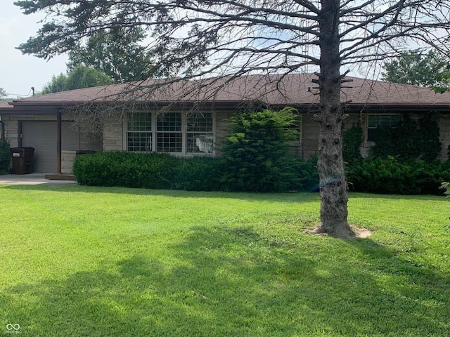 24 David Dr, North Vernon, IN 47265 - ranch-style house with a garage and a front lawn