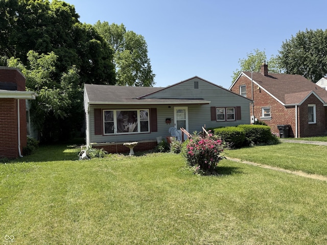 1227 W 9th St, Anderson, IN 46016 - bungalow featuring a front lawn