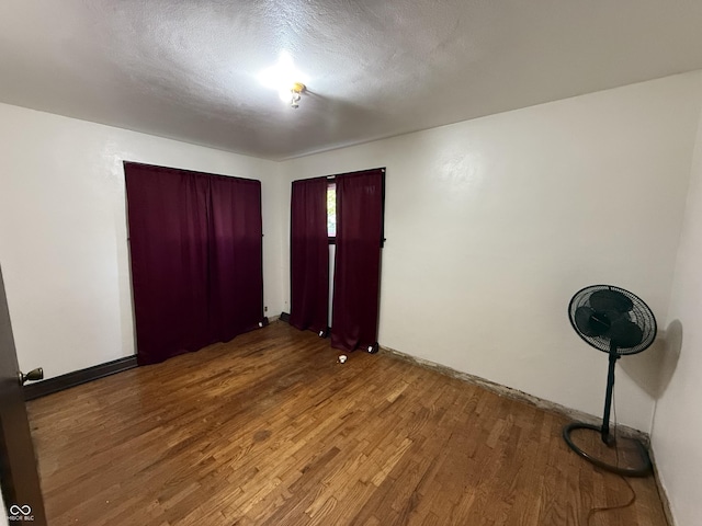 1227 W 9th St, Anderson, IN 46016 - empty room with wood finished floors