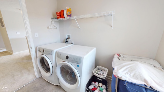 16551 Branham Dr, Fishers, IN 46040 - laundry area featuring independent washer and dryer and light colored carpet