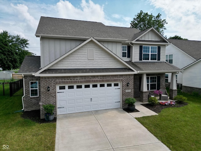 16551 Branham Dr, Fishers, IN 46040 - craftsman-style house with driveway, brick siding, board and batten siding, a garage, and covered porch