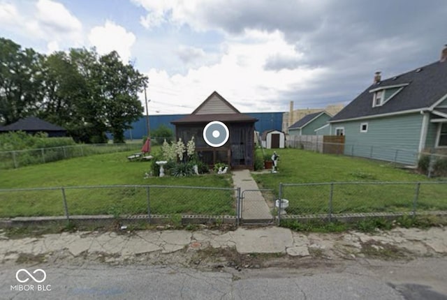 2021 Columbia Ave, Indianapolis, IN 46202 - bungalow-style home with a fenced front yard and a gate