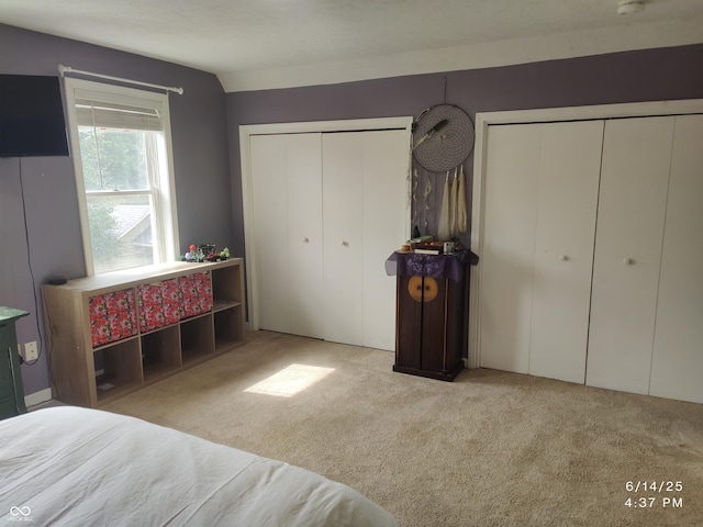 121 N Main St, Pendleton, IN 46064 - carpeted bedroom featuring multiple closets and lofted ceiling