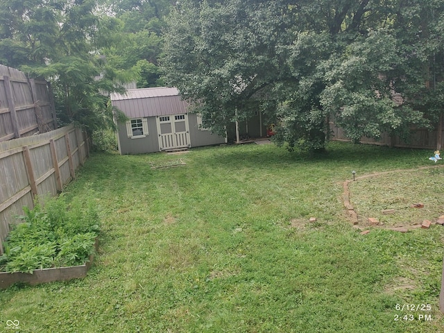 121 N Main St, Pendleton, IN 46064 - fenced backyard featuring a vegetable garden and a storage shed