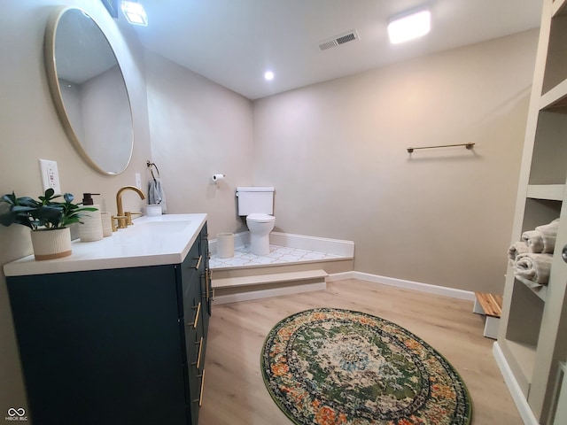 702 W Cross St, Brownstown, IN 47220 - bathroom with vanity and wood finished floors