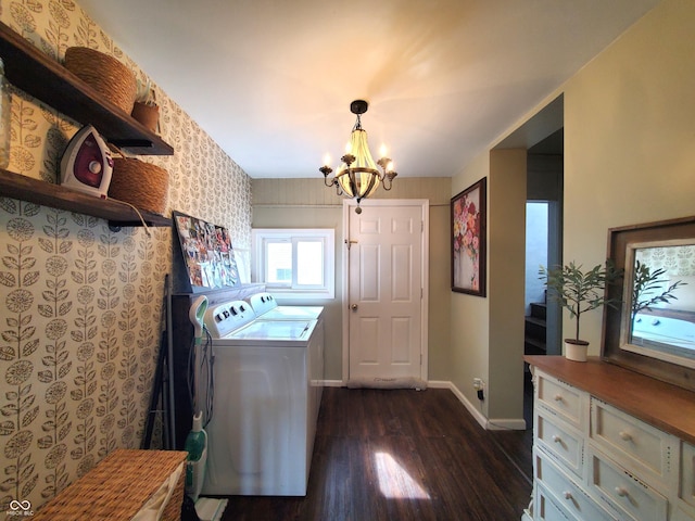 702 W Cross St, Brownstown, IN 47220 - laundry room featuring washing machine and clothes dryer, dark wood-type flooring, and a chandelier