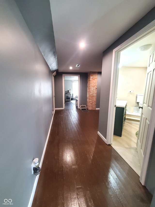 702 W Cross St, Brownstown, IN 47220 - hall with wood-type flooring and baseboards