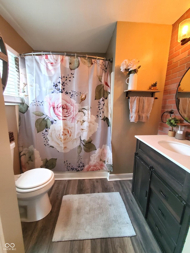 702 W Cross St, Brownstown, IN 47220 - bathroom with vanity, wood finished floors, and a shower with shower curtain