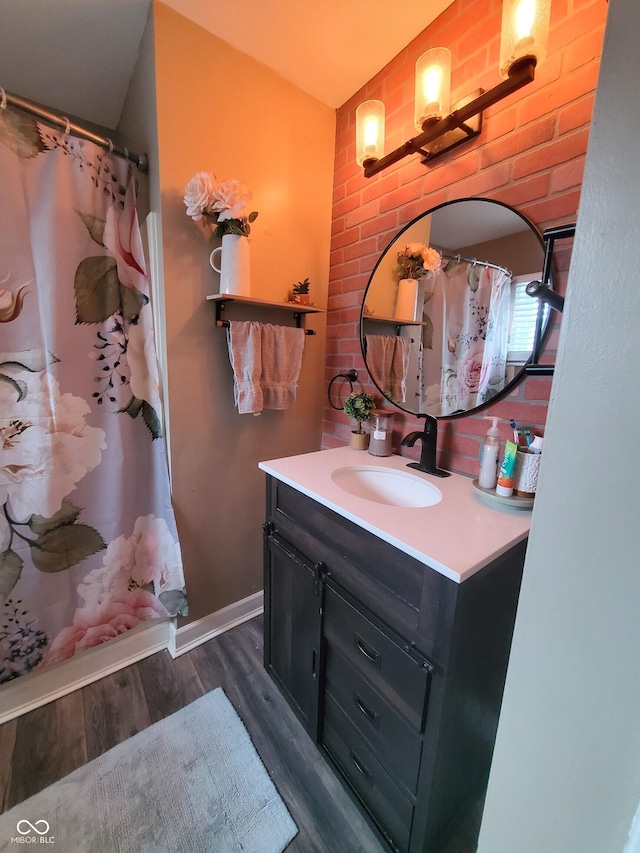 702 W Cross St, Brownstown, IN 47220 - full bathroom featuring vanity, wood finished floors, and a shower with shower curtain