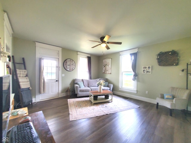 702 W Cross St, Brownstown, IN 47220 - living room featuring dark wood-style floors and a ceiling fan