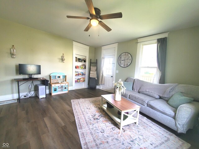 702 W Cross St, Brownstown, IN 47220 - living room with ceiling fan and dark wood-type flooring