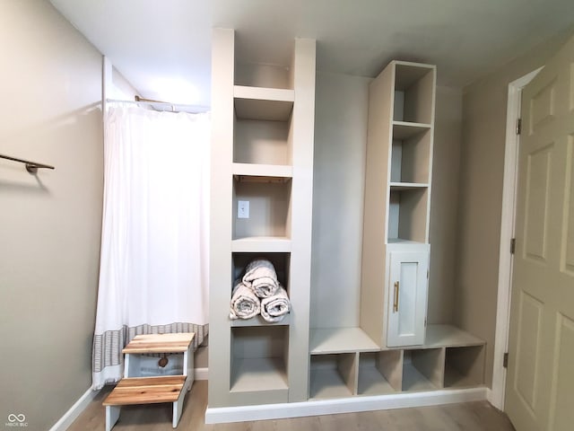 702 W Cross St, Brownstown, IN 47220 - mudroom with wood finished floors and built in shelves