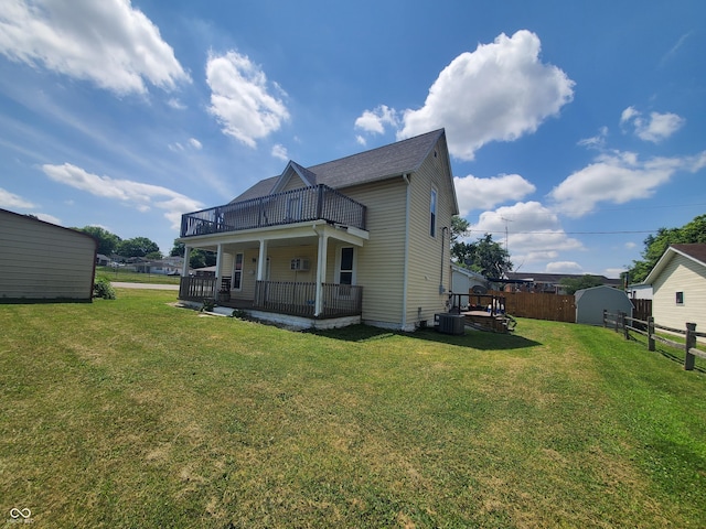 702 W Cross St, Brownstown, IN 47220 - rear view of house featuring a storage unit and a deck