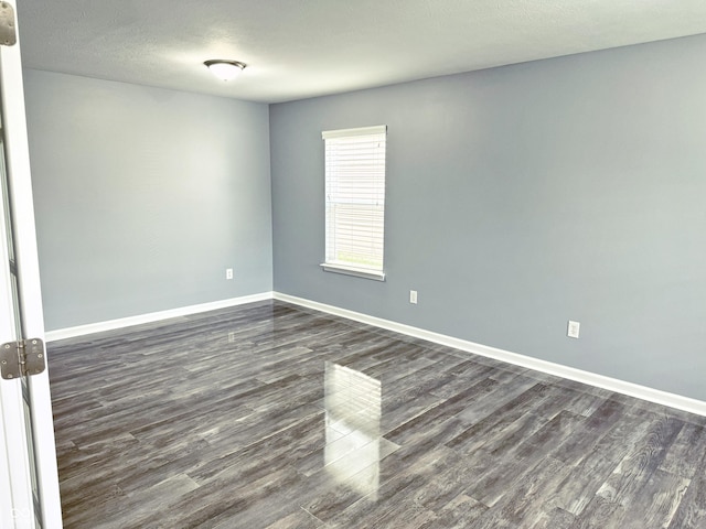 3314 Montgomery Dr, Indianapolis, IN 46227 - spare room with dark wood-type flooring