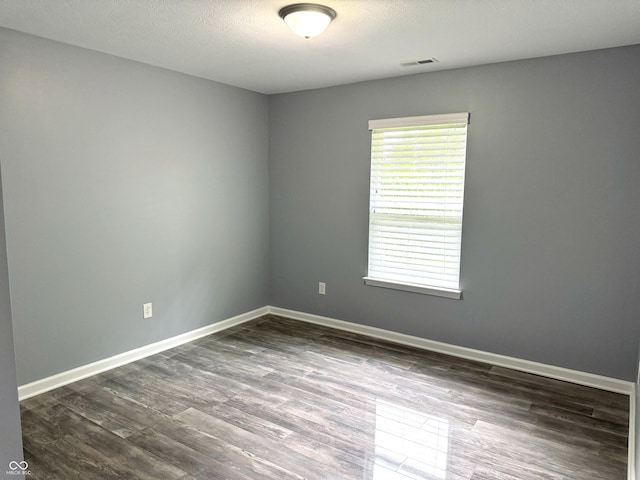 3314 Montgomery Dr, Indianapolis, IN 46227 - spare room featuring dark wood-type flooring