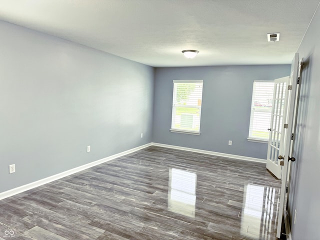 3314 Montgomery Dr, Indianapolis, IN 46227 - empty room with baseboards and dark wood-style floors
