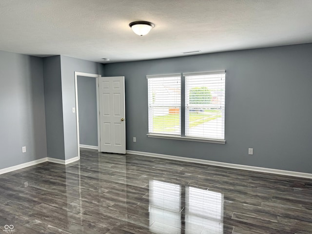 3314 Montgomery Dr, Indianapolis, IN 46227 - empty room featuring a textured ceiling and wood finished floors