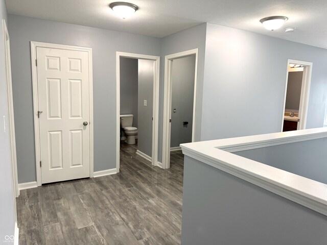 3314 Montgomery Dr, Indianapolis, IN 46227 - corridor featuring dark wood finished floors and baseboards