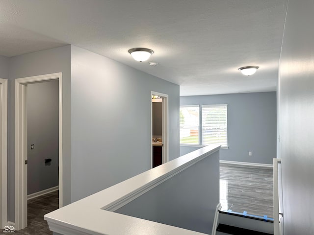 3314 Montgomery Dr, Indianapolis, IN 46227 - hall featuring dark wood-style floors and a textured ceiling