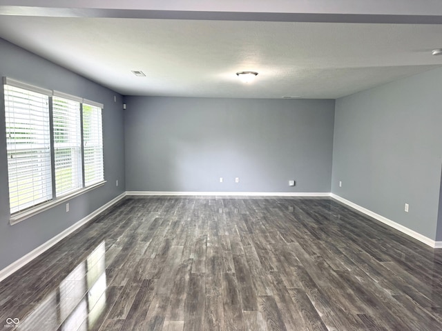 3314 Montgomery Dr, Indianapolis, IN 46227 - spare room featuring dark wood-style floors and baseboards