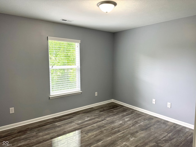 3314 Montgomery Dr, Indianapolis, IN 46227 - unfurnished room featuring dark wood-type flooring and baseboards