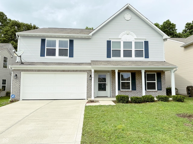 3314 Montgomery Dr, Indianapolis, IN 46227 - traditional home with concrete driveway, a front lawn, a garage, covered porch, and brick siding