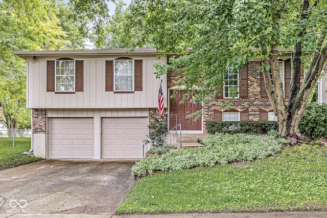 7616 Concord Ln, Fishers, IN 46038 - view of front facade featuring brick siding, an attached garage, and driveway