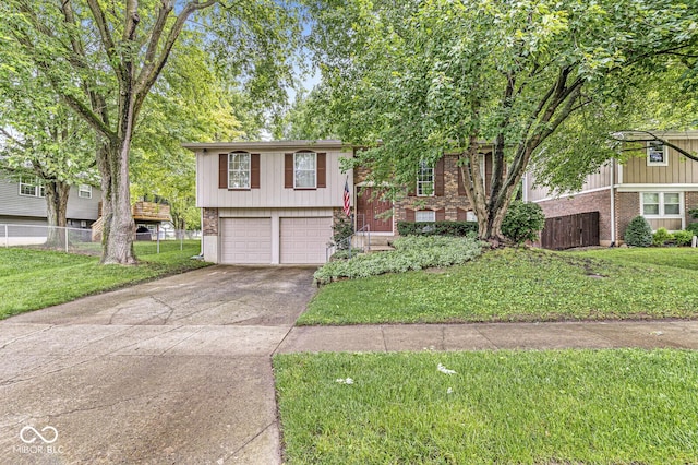 7616 Concord Ln, Fishers, IN 46038 - view of front facade with brick siding, an attached garage, and concrete driveway