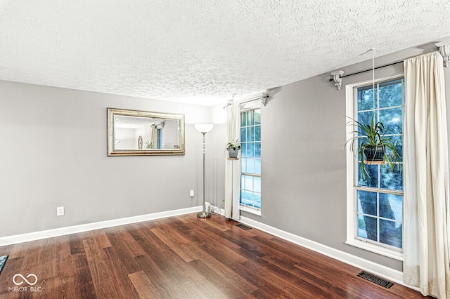 7616 Concord Ln, Fishers, IN 46038 - empty room with wood finished floors and a textured ceiling