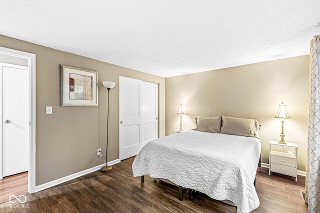 7616 Concord Ln, Fishers, IN 46038 - bedroom featuring wood finished floors and a textured ceiling