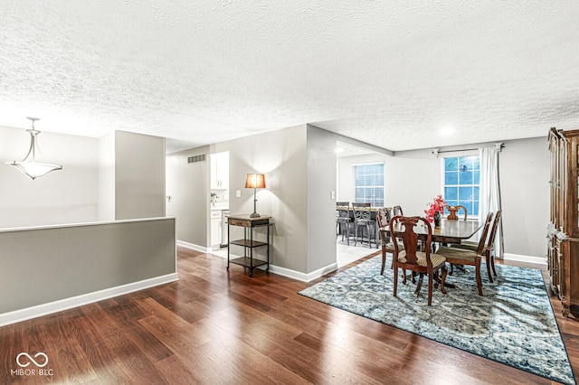 7616 Concord Ln, Fishers, IN 46038 - dining room featuring a textured ceiling and dark wood-style floors