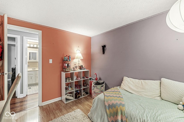 7616 Concord Ln, Fishers, IN 46038 - bedroom with wood finished floors and a textured ceiling