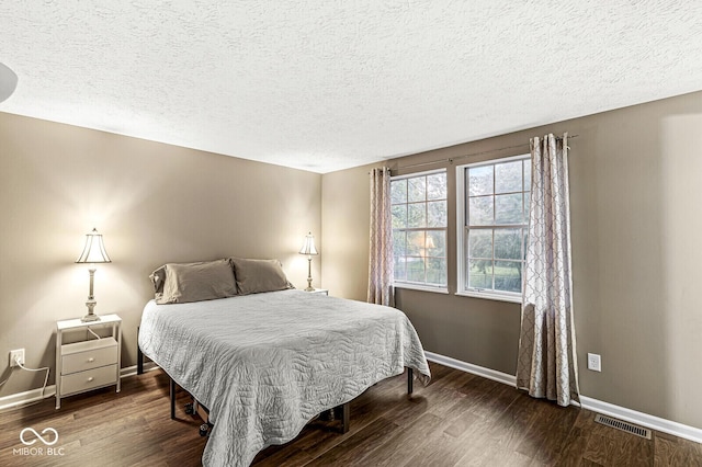 7616 Concord Ln, Fishers, IN 46038 - bedroom featuring wood finished floors and a textured ceiling