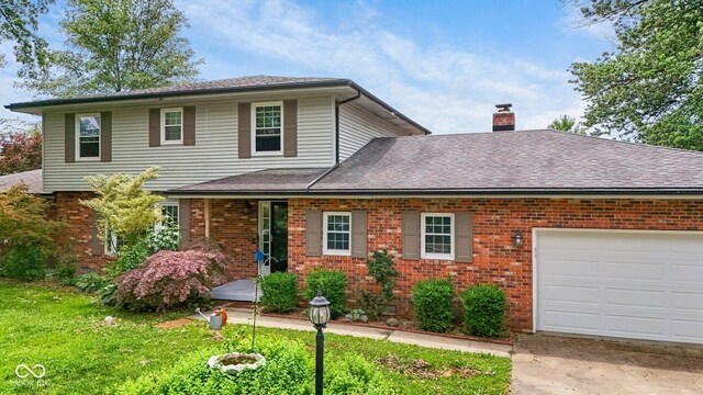 925 W Hancock Rd, Scottsburg, IN 47170 - traditional-style home with a garage, a chimney, brick siding, and a shingled roof
