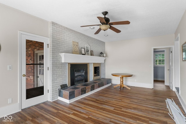 925 W Hancock Rd, Scottsburg, IN 47170 - living room with ceiling fan, wood finished floors, and a tile fireplace