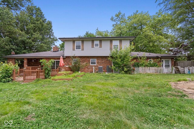 925 W Hancock Rd, Scottsburg, IN 47170 - back of house featuring brick siding and a chimney