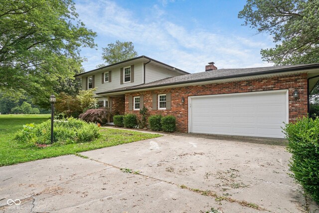 925 W Hancock Rd, Scottsburg, IN 47170 - traditional-style home featuring brick siding, driveway, a chimney, a garage, and a front lawn