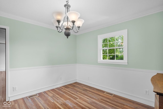 925 W Hancock Rd, Scottsburg, IN 47170 - unfurnished room with a chandelier, wood finished floors, and crown molding