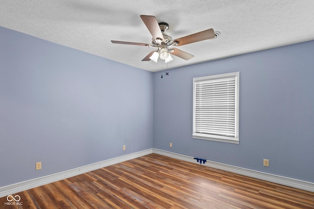 925 W Hancock Rd, Scottsburg, IN 47170 - unfurnished room with wood finished floors, ceiling fan, and a textured ceiling