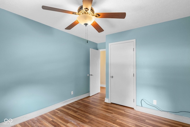 925 W Hancock Rd, Scottsburg, IN 47170 - spare room featuring wood finished floors and ceiling fan