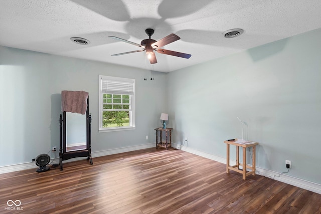 925 W Hancock Rd, Scottsburg, IN 47170 - empty room featuring wood finished floors, ceiling fan, and a textured ceiling
